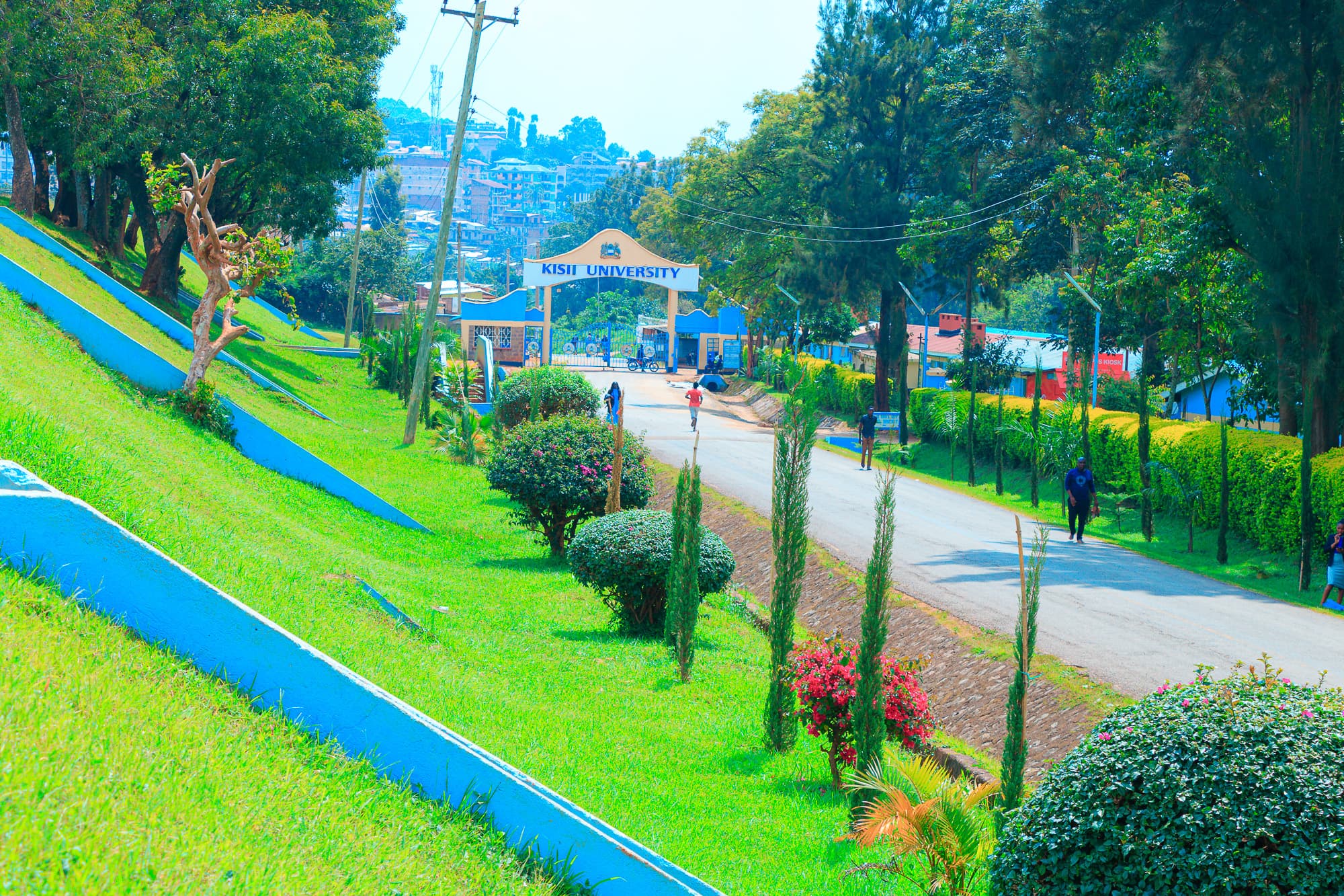 Undergraduate students walking through Kisii University